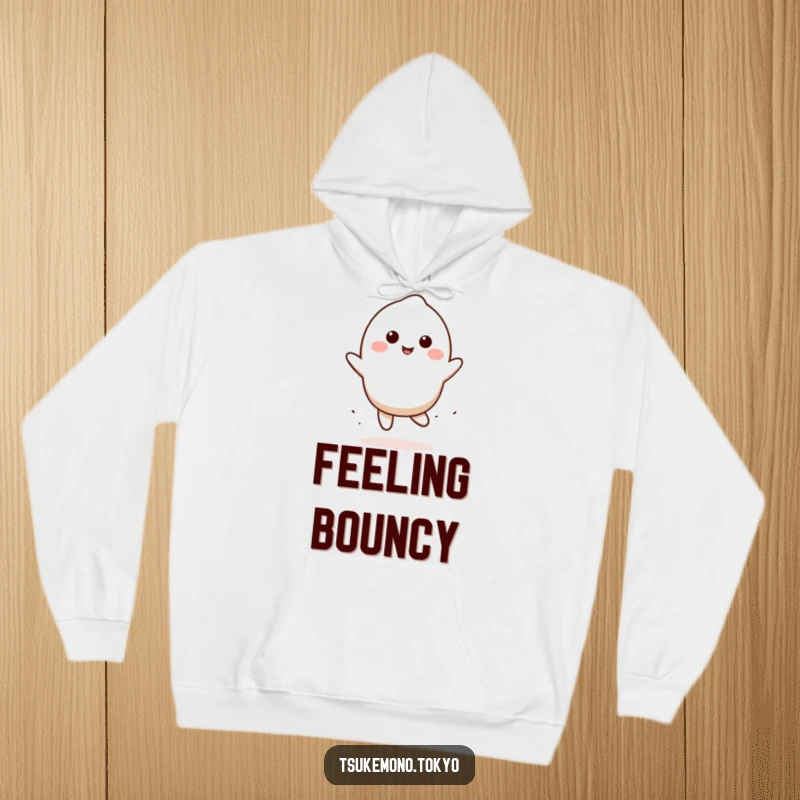 Funny mochi hoodie featuring a smiling character in a playful bounce, perfect for staying warm and happy, a funny gift.